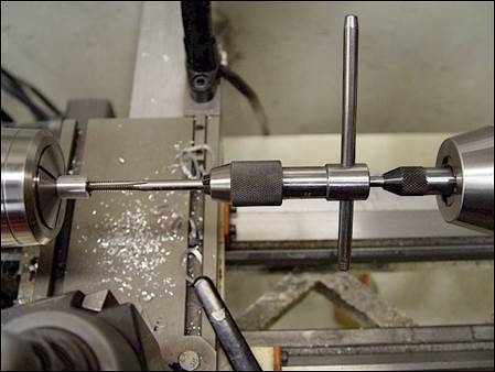 how can a tap be aligned when threading a hole on the lathe?