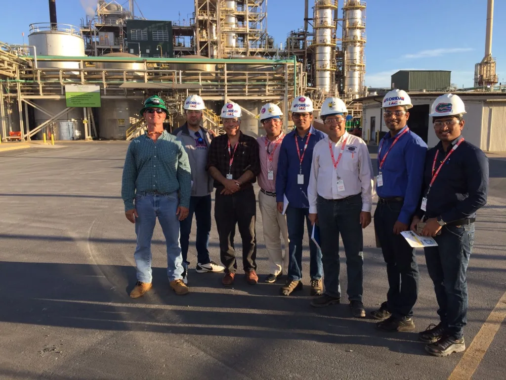 Drs SA Sherif and Christian Cardenas-Lailhacar with their graduate students at an energy facility.