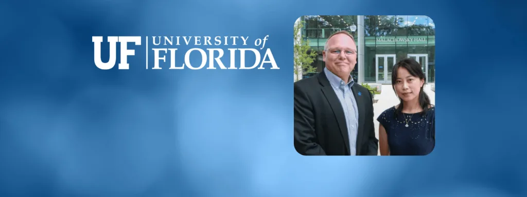 Dr. Jie Fu and Dr. Warren Dixon pose for a picture in front of Malachowsky Hall along with blue background and university of florida logo