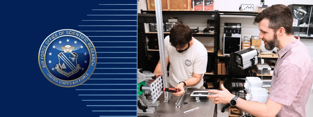 Musgraves working with a student on a project