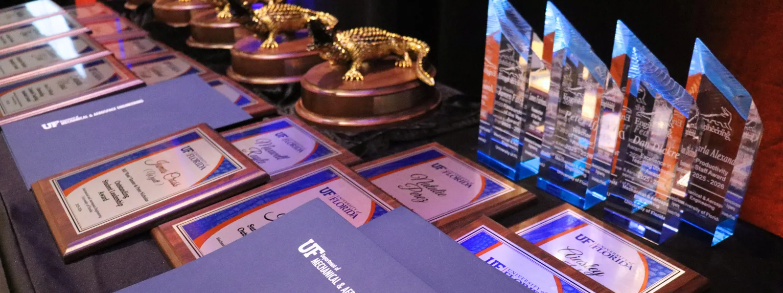 A table filled with Awards and Trophies.