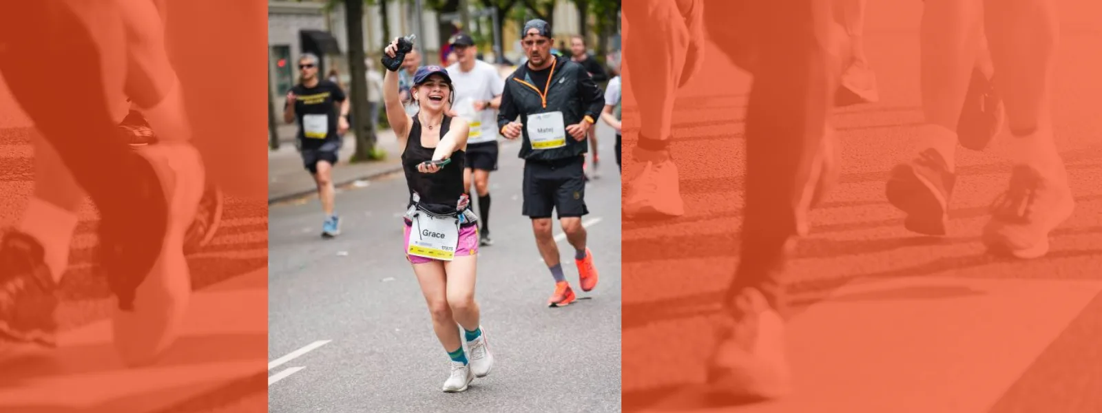 Grace Tran doing the "gato chomp" while running in a marathon. Other runners seen in the background, overlayed over monotone orange image of runners legs.