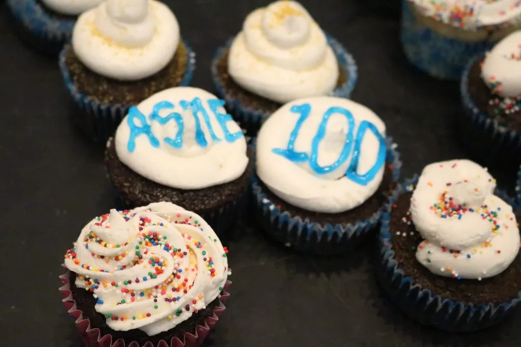 Cupcakes with "ASME" and "100" written on them